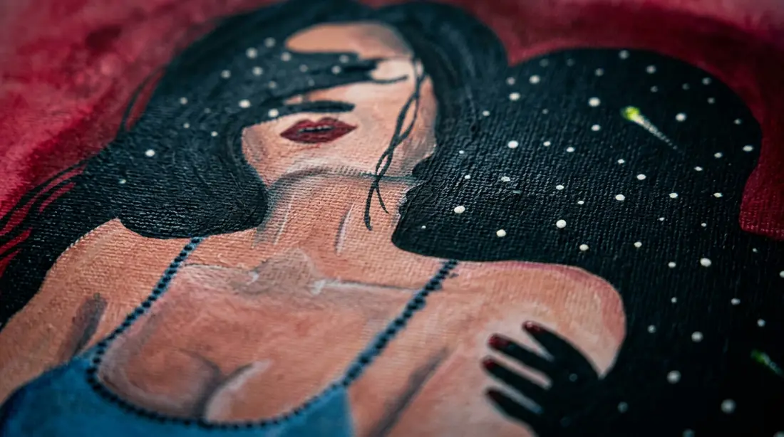 Face half hidden by a starry hand